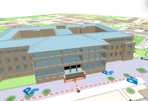 Großes braunes Büro-/Campusgebäude mit blauem Dach und vielen Fenstern; zentrale Eingangstreppe vor Glasfront; liegt auf einem farbigen Stadt- oder Campusplan.