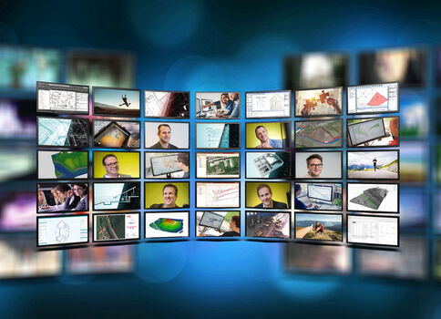 Eine wellenförmige Anordnung vieler Bildschirme zeigt Karten, Diagramme, Grafiken und Porträts von Personen vor blauem, unscharfem Hintergrund.