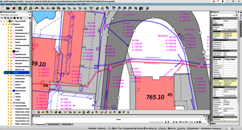 Ansicht eines Geoinformationssystems (GIS) mit farbcodierten Parzellen, Versorgungsnetzen und Knotenpunkten; viele Beschriftungen und Messwerte über einer Kartenansicht.